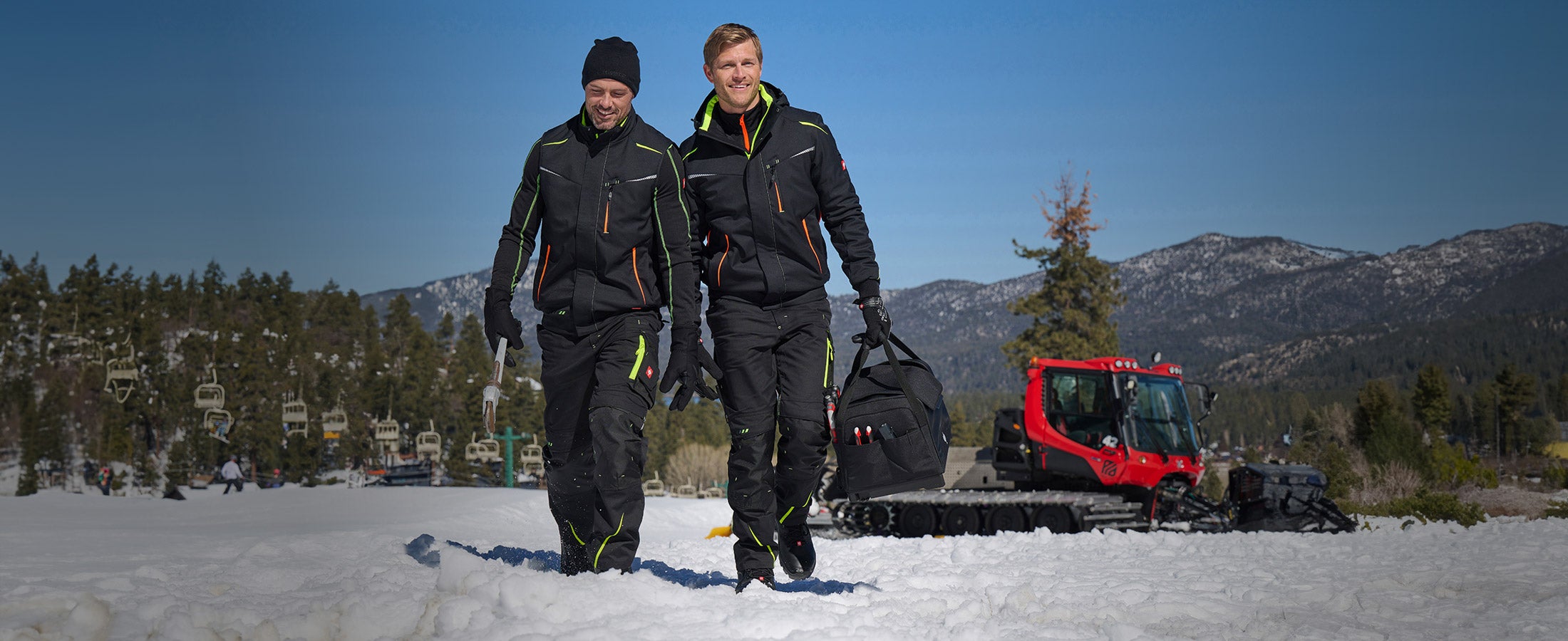 Two men wearing clothing from the e.s.motion2020 collection in a winter landscape