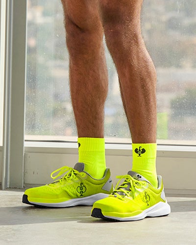 Person with bright yellow socks and shoes